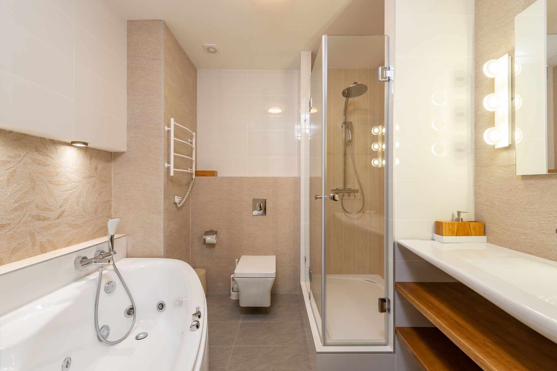 A newly fitted bathroom with a bathtub and glass shower